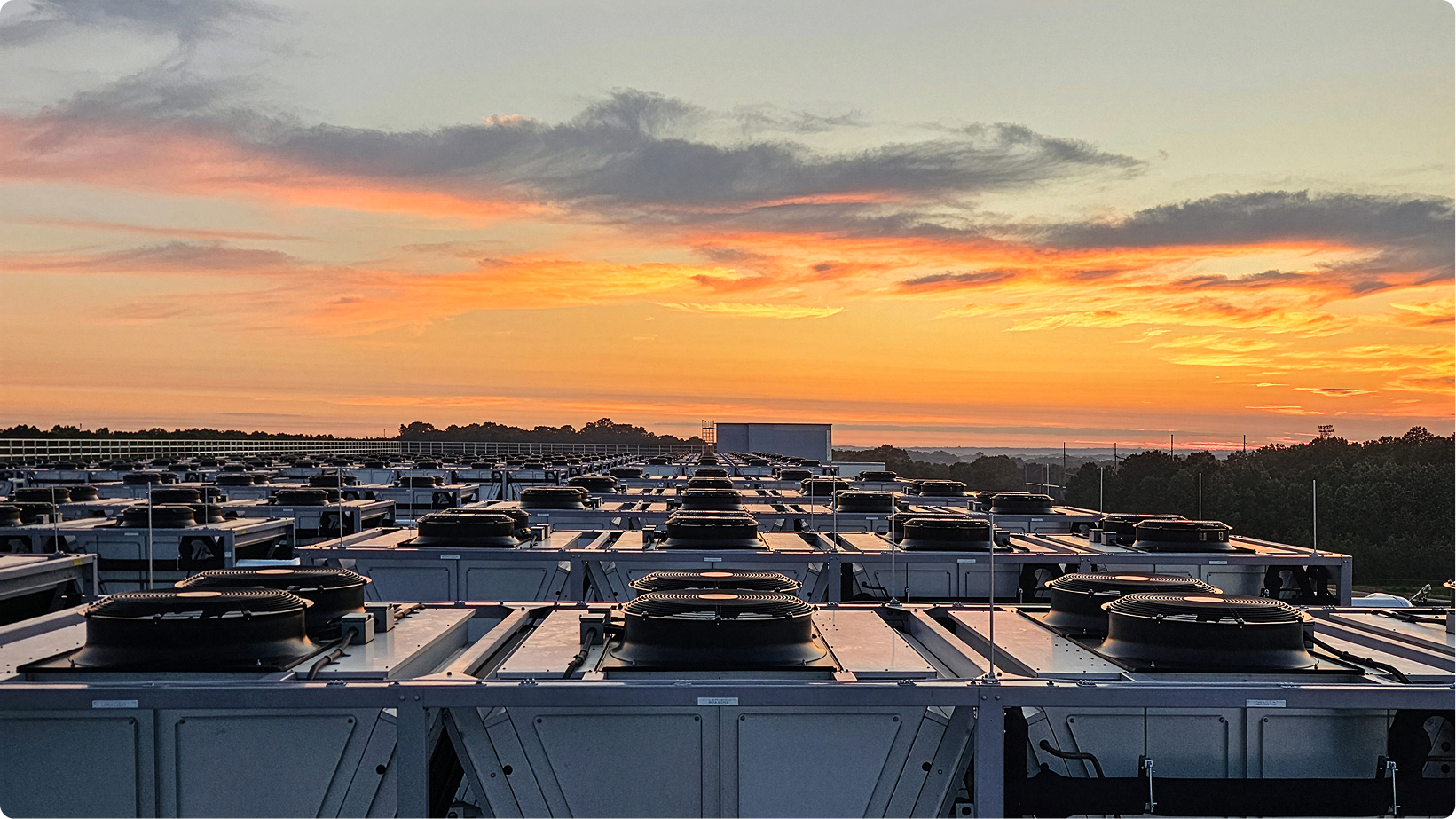 Data-center cooling units at sunset